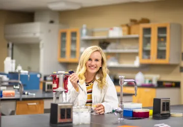 A biologist in a classroom
