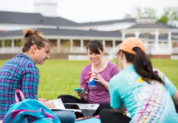 Students seated outside