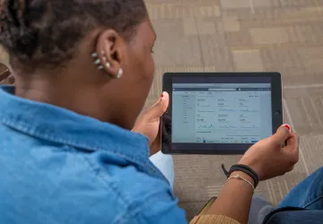 A woman looking at a tablet