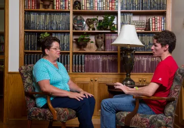 A counselor speaking with a student