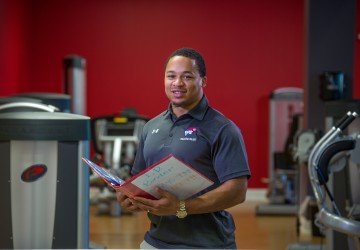 A personal trainer in a gym