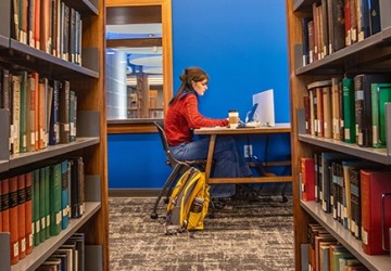 Student studying in a library