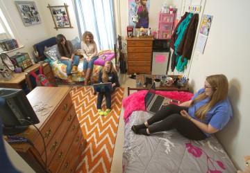 Students sitting in a dorm room
