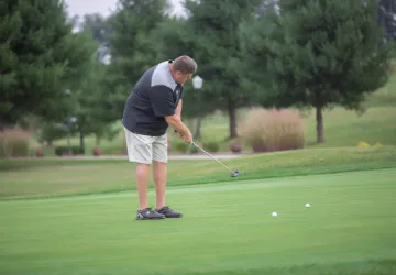 A golfer putting