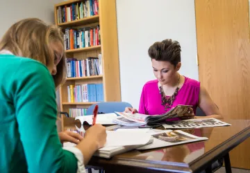Two students studying at a table