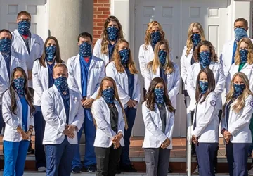 Students wearing physician coats