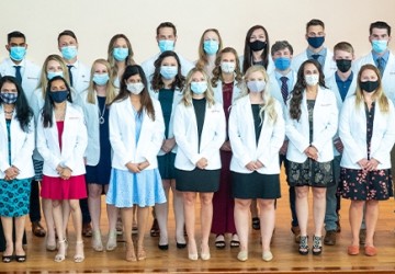 Students wearing physician coats
