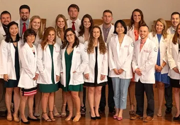 Students wearing physician coats