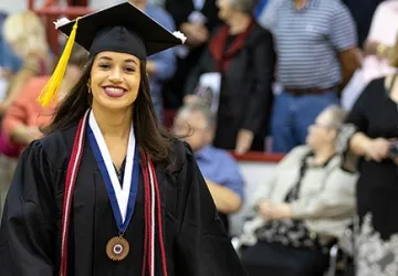 A student wearing a cap and gown