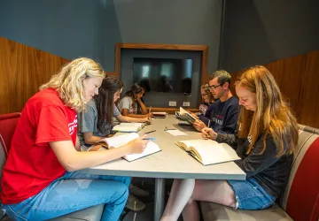 Students studying at a table