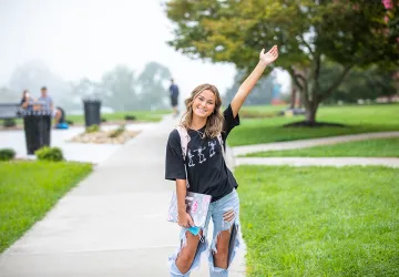 Student poses for a photo on campus