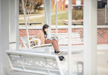 Girl using a laptop outdoors