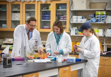 Three biologists working