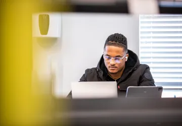 A student using a laptop