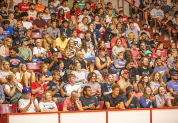 Students seated on bleachers