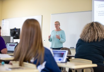 A counselor speaking to a class