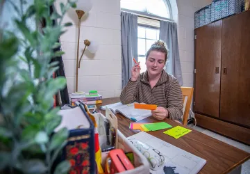A student studying in their dorm