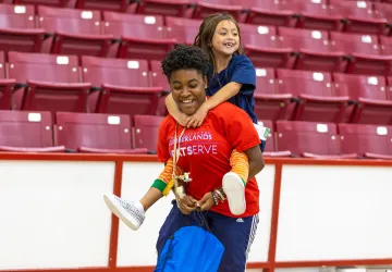 A Cumberlands student spends time with a local child during Shoes 4 the Soul
