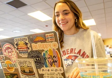 A student using a laptop