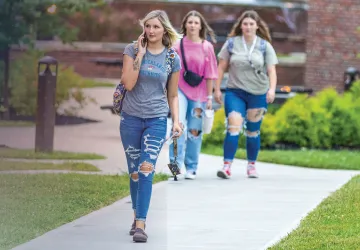 Students walk across campus near Grace Crum on the first day of class