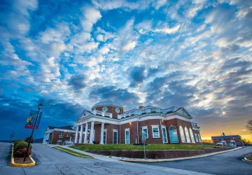 Sun rises over the campus science center. 
