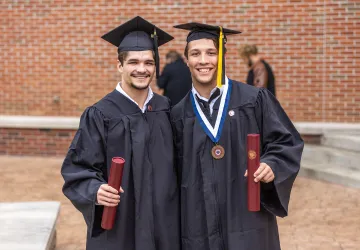 Students display their diplomas following Cumberlands graduation. 
