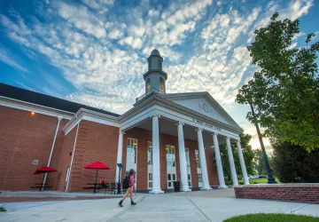 A student walks to class near the Rollins athletics center. 