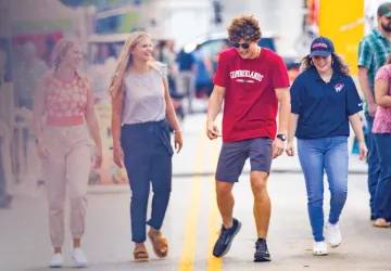 Students visit a festival in downtown Williamsburg.