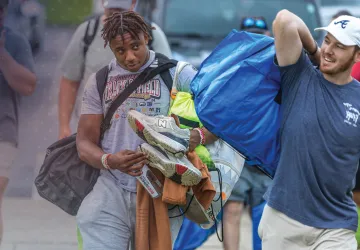 Student-athletes moving into the dorms during move-in day.