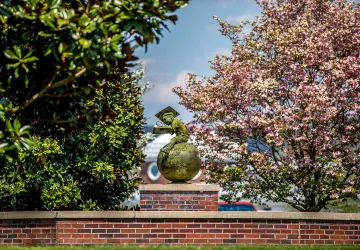 The globe statue in front of the education building. 