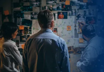 Criminal Justice Employees Working on a Board