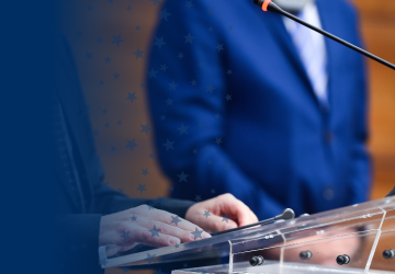 Person Speaking at Podium