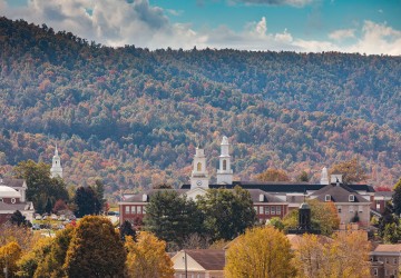 A view of campus depicting several buildings among the autumn foliage. 