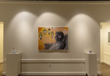 A student painting of an older woman inside the Cumberlands art gallery. 