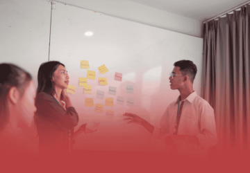 Project Managers Discussing Solutions at a Whiteboard