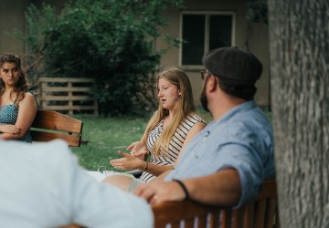 Student Liberty Poley discusses her time at Cumberlands outside in a circle of friends. 