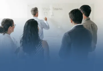 Business Professionals Taking Notes in Meeting
