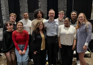 Lisa Bartram stands with a group of students after being recognized by the Association for the Promotion of Campus Activities. 
