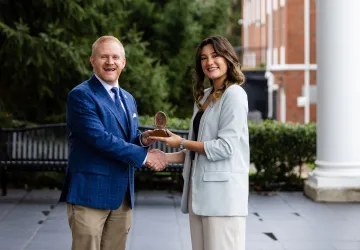 President Young presents an academic award to Joy Kendrick.