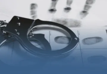 Handcuffs on Fingerprinted Paper