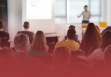 Educator at the Front of a Classroom Lecturing