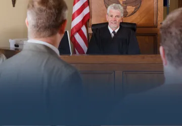 Judge with Lawyers in Courtroom