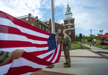 ROTC cadets present the American flag during a campus ceremony. 