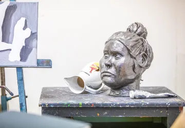 A artistic statue of a woman's head is displayed in Cumberlands art studio. 