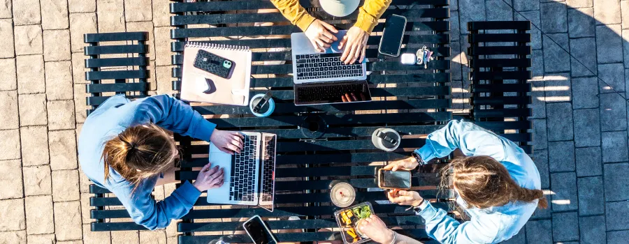 An aerial footage of several students studying outside