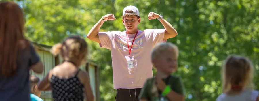 guy leading kids' recreation activities
