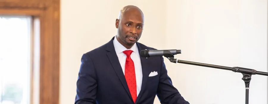 man speaking into a microphone