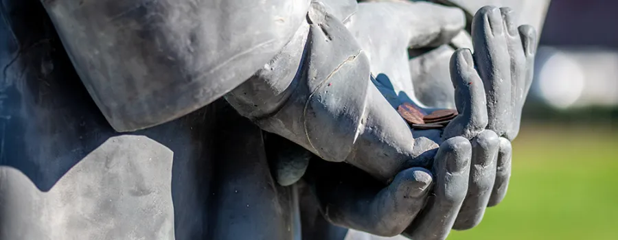 Pennies in the hands of Lincoln's statue for good luck