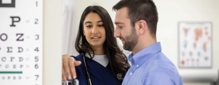PA student checks a patient's weight