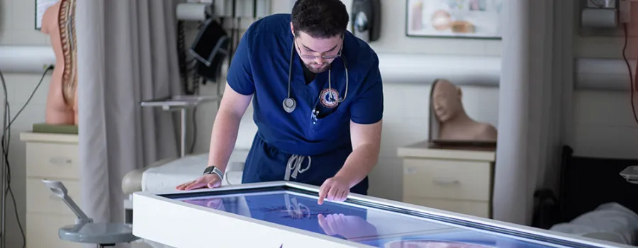 PA student using Anatomage table in PA lab